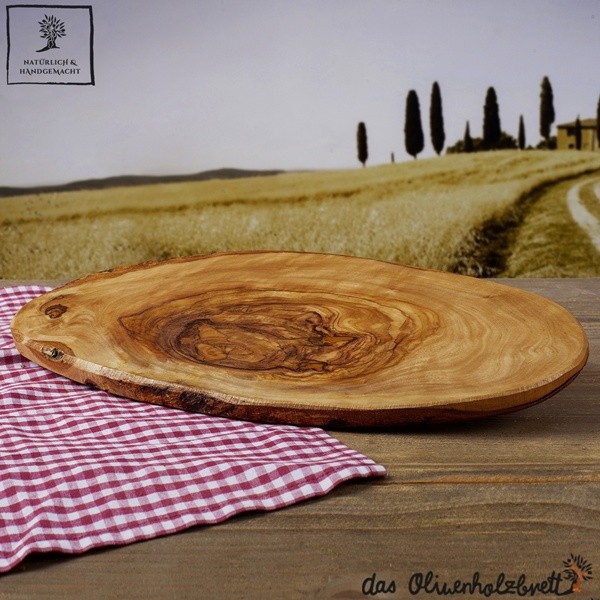 Olive wood tree trunk cutting board with bark