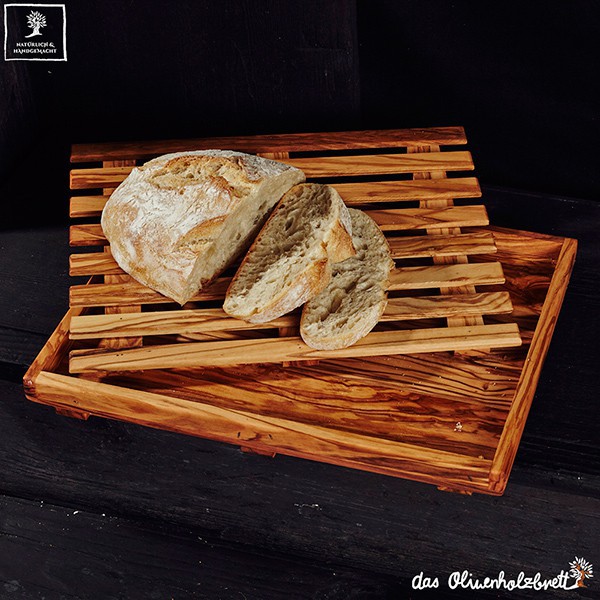 Cutting board for bread with removable crumb tray.